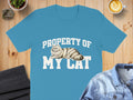 Blue t-shirt with "Property of My Cat" text and a Persian cat graphic.