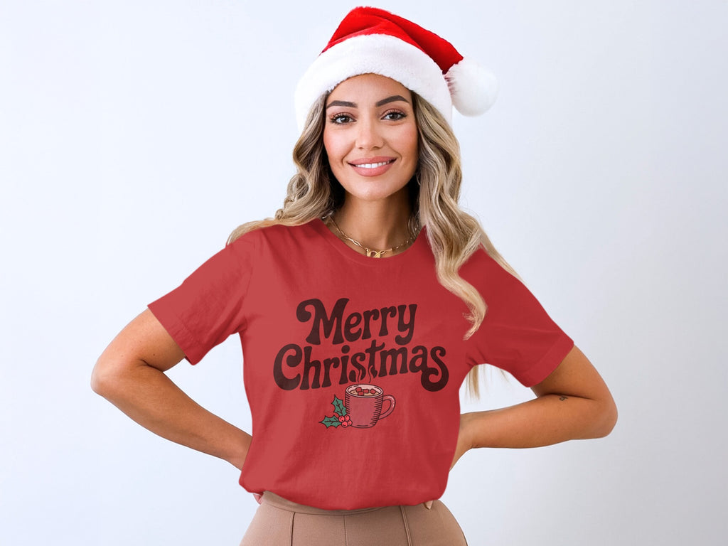 Red t-shirt with "Merry Christmas" text, hot chocolate, and holly graphic.